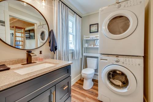 a bathroom with a washing machine and a sink at Lake Martin Retreat with Private Dock and Boat Launch in Dadeville