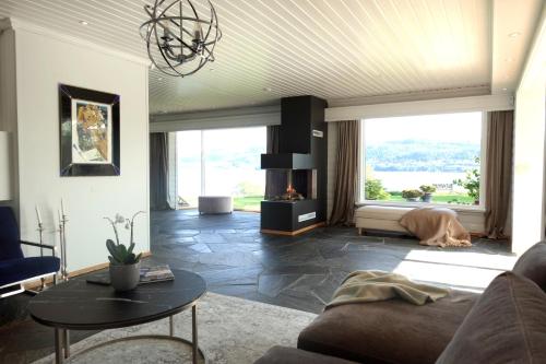 a living room with a dog laying on the floor at Villa Arboretet - Seaside villa with private pool & infrared sauna in the heart of Arboretet, Bergen in Bergen
