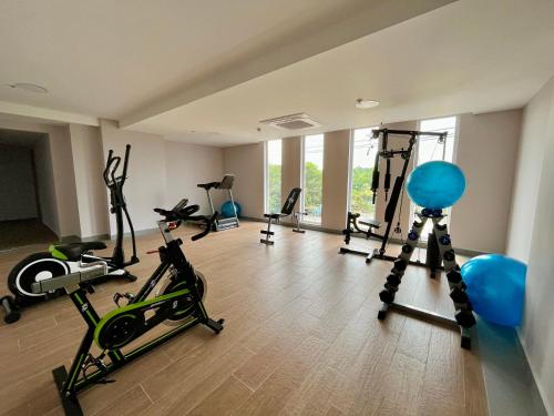 a gym with several exercise equipment in a room at Wyndham Garden Cartagena in Cartagena de Indias