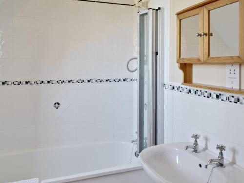 a bathroom with a sink and a shower at Ryndle Corner in Scarborough