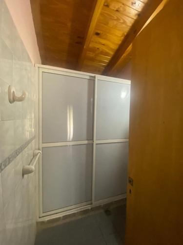 a bathroom with white cabinets in a room at LA NEGRITA in Ciudad Lujan de Cuyo