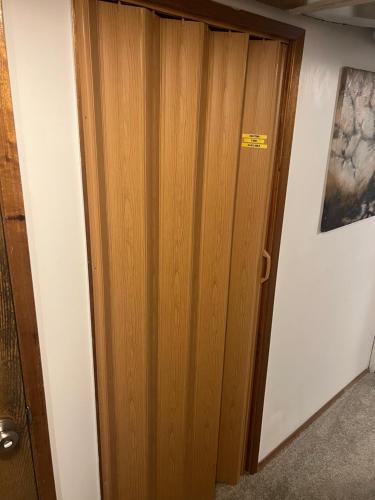 a wooden door in a room next to a wall at Anthony's Home in Spokane