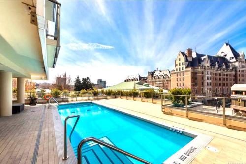 a swimming pool on the roof of a building at Waterfalls Hotel in Downtown With Stunning Views! in Victoria