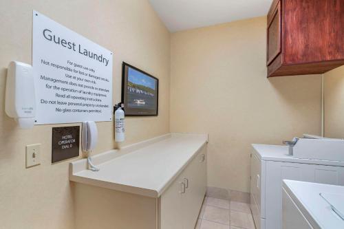 a small kitchen with a sink and a phone at Comfort Suites Lake Geneva East in Lake Geneva