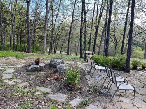 a group of benches sitting in a park at Beautiful Parkside Suite in Saint James