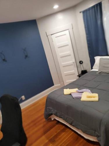 a bedroom with a bed with two towels on it at downtown and secluded in Manchester
