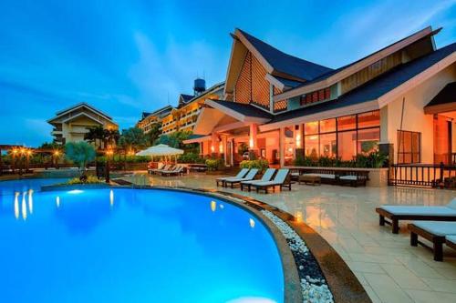 a swimming pool in front of a building at Keira 208, Alta Vista De Boracay in Boracay