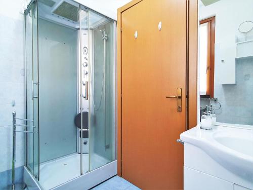 a bathroom with a shower and a sink at Belvilla by OYO BOS03 3 in Grantola