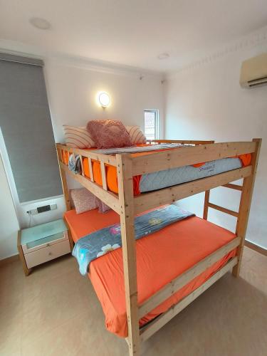 a couple of bunk beds in a room at Kajang Pool Party Villa in Kajang