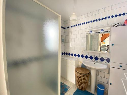 a bathroom with a shower and a sink at Holiday Home in Normandy near Sandy Beach in Hauteville-sur-Mer
