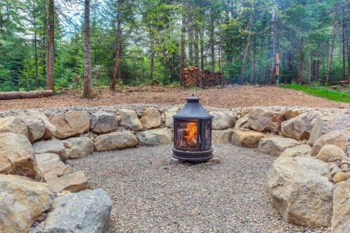 a lantern sitting on top of a pile of rocks at Tremblant chalet O-Spa in Lac-Superieur