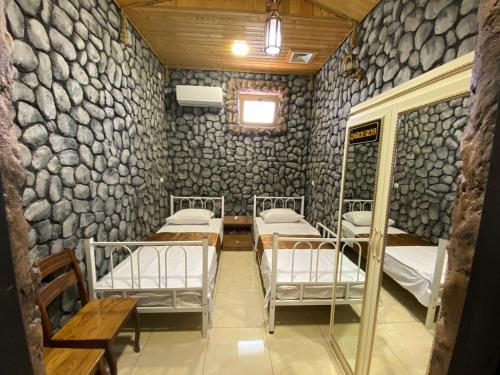 Postel nebo postele na pokoji v ubytování MANGAL HOTEL&HOSTEL