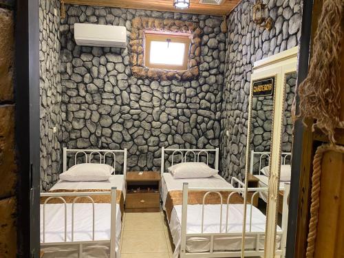 Postel nebo postele na pokoji v ubytování MANGAL HOTEL&HOSTEL