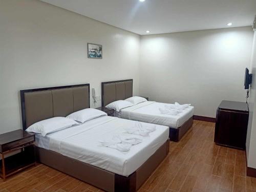 Postel nebo postele na pokoji v ubytování ASIA JEM HOTEL - GAPAN CITY