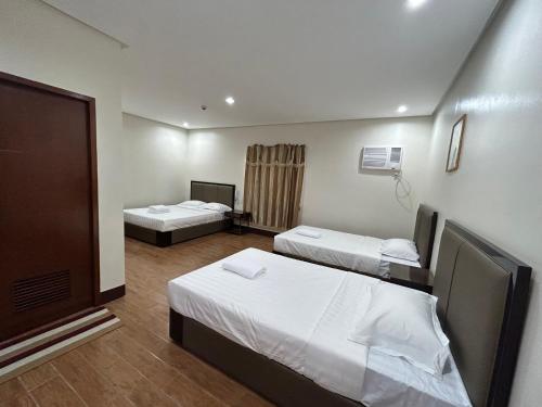 Postel nebo postele na pokoji v ubytování ASIA JEM HOTEL - GAPAN CITY