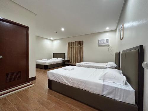 Postel nebo postele na pokoji v ubytování ASIA JEM HOTEL - GAPAN CITY