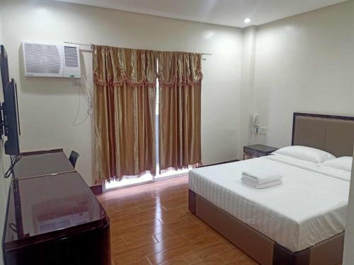 Postel nebo postele na pokoji v ubytování ASIA JEM HOTEL - GAPAN CITY