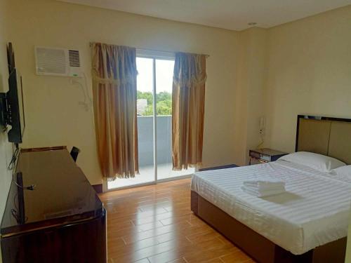Postel nebo postele na pokoji v ubytování ASIA JEM HOTEL - GAPAN CITY