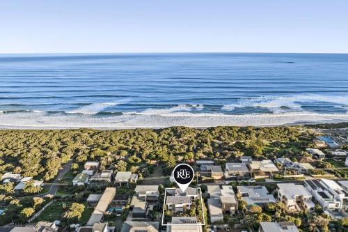 an aerial view of a beach with a stop sign at Orton Oceanview Luxury Retreat in Ocean Grove
