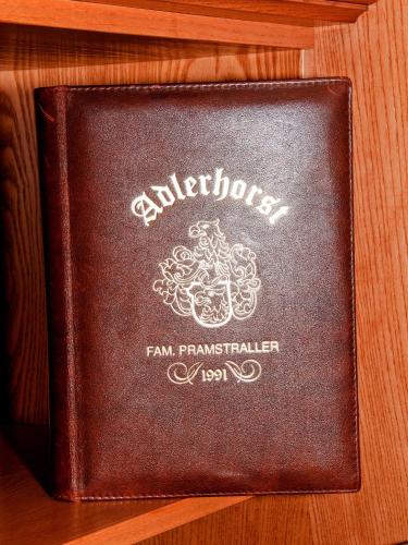 a brown passport sitting on a wooden shelf at Adlerhorst , Gstan 31 in Finkenberg