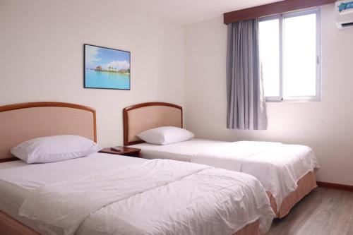 Postel nebo postele na pokoji v ubytování Tinian Lucky Home