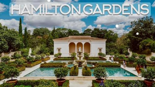 a magazine cover of a garden with a fountain at 2 Bedroom Home away from Home near CBD & private parking in Hamilton