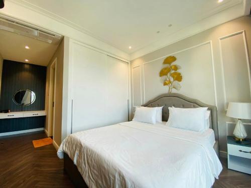 Ένα ή περισσότερα κρεβάτια σε δωμάτιο στο Amanda Apartment Quy Nhon