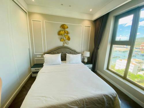 Ένα ή περισσότερα κρεβάτια σε δωμάτιο στο Amanda Apartment Quy Nhon