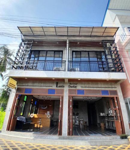 a building with a balcony on the side of it at Lanta Chaolay in Ko Lanta
