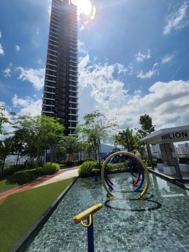 a water slide in a park with a tall building at Urban Suites - Penang in Jelutong