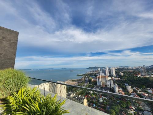 a view of the city and the ocean from a building at Urban Suites - Penang in Jelutong