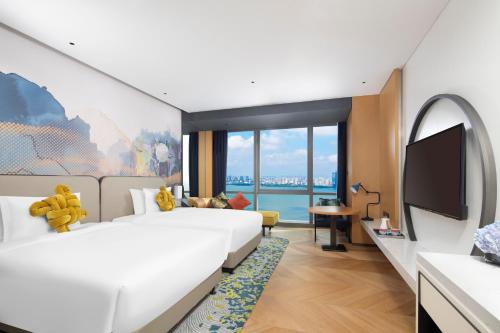 Postel nebo postele na pokoji v ubytování M Social Hotel Suzhou