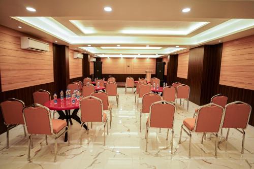 a conference room with tables and chairs in it at Gogol Beach Resort !! Beach 1 Minute !! in Mandarmoni