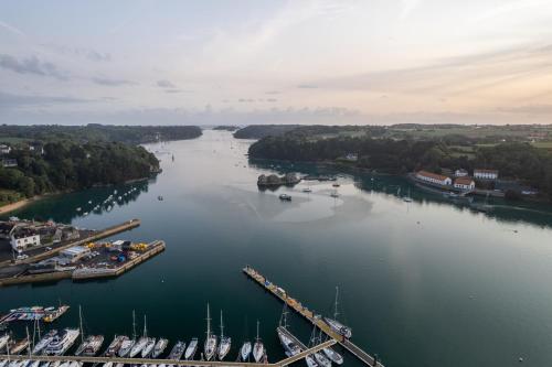an aerial view of a river with boats docked at Gîte de la Presqu'île de Lézardrieux, adapté PMR in Lézardrieux