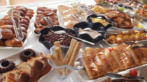 a table full of different types of pastries and desserts at Hotel Labella Bergama in Bergama