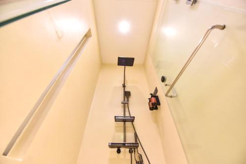a stairwell in a house with a camera on it at Two Couples Leisure Art Motel in Tainan
