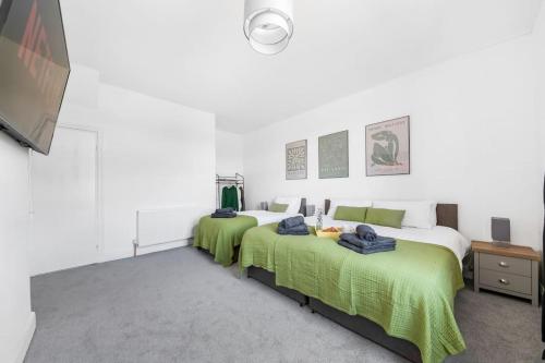 Ένα ή περισσότερα κρεβάτια σε δωμάτιο στο Spacious Home In The Heart of West Yorkshire
