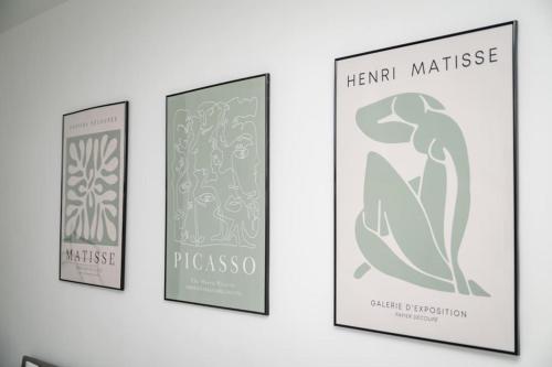 three framed illustrations of a mermaid on a wall at Spacious Home In The Heart of West Yorkshire in Brighouse