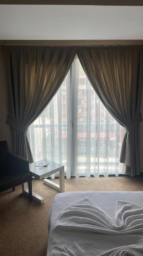 Cama ou camas em um quarto em Hotel La Bella Soma