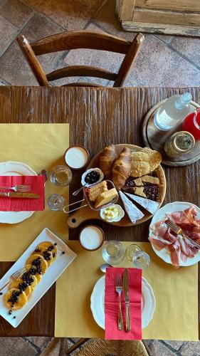 a table with a bunch of food on it at Locanda Il Sigillo B&B e Ristorante in Rosignano Marittimo