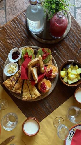 a table with a plate of food on a table at Locanda Il Sigillo B&B e Ristorante in Rosignano Marittimo