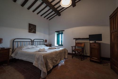 En eller flere senge i et værelse på La Capretta Country House