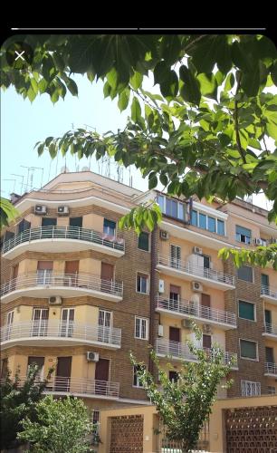 a tall building with balconies on the side of it at PeoniaMaximaHouse -Piazza Bologna- in Rome