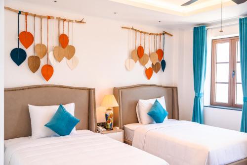 Roma Hotel Phu Quoc - Free Airport Shuttle & Sunset Town Tourにあるベッド