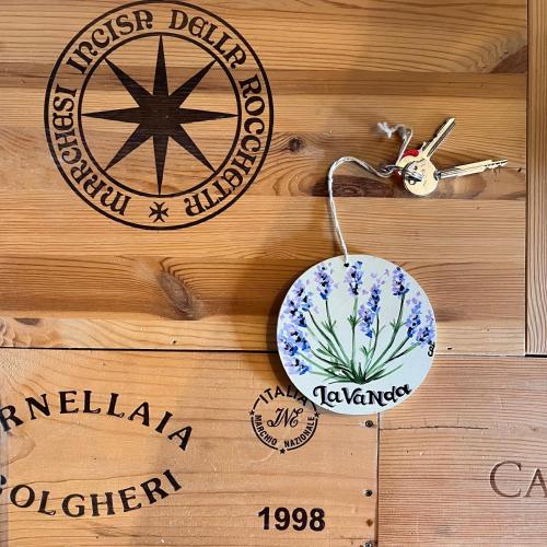a wooden wall with two ornaments on it at Locanda Il Sigillo B&B e Ristorante in Rosignano Marittimo