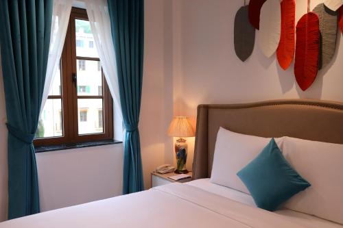 Roma Hotel Phu Quoc - Free Airport Shuttle & Sunset Town Tourにあるベッド