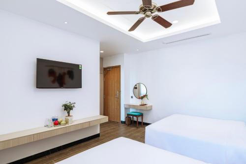Roma Hotel Phu Quoc - Free Airport Shuttle & Sunset Town Tourにあるベッド