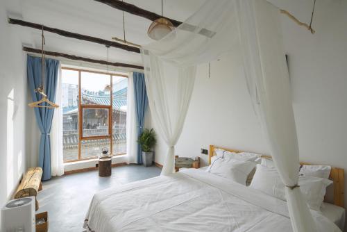Φωτογραφία από το άλμπουμ του Chang'an-Yi Designer B&B - Xi'an Bell and Drum Tower Hui Min Street Branch στη Σιάν