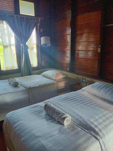 Postel nebo postele na pokoji v ubytování Oinan Guest House