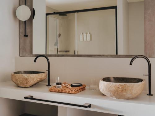 two sinks on a counter in a bathroom at Hyde Ibiza in Cala Llonga